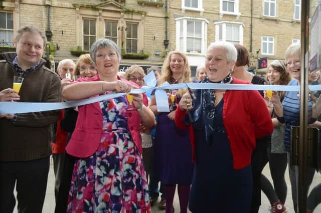 Current manager Angela Hill and Edwina Buczynski who was the first manager reopen the refurbished Cancer Research shop on Buxton's Spring Gardens.