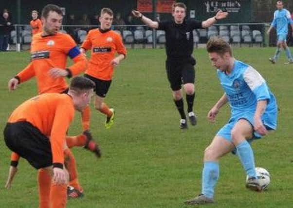Pictured is Clay Cross player Ben Goodwin on the ball against Harworth.