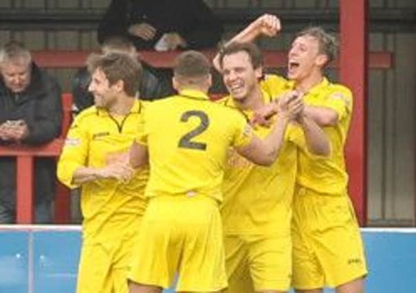 Danny Holland (second from right) is congratulated after scoring against Ilkeston on Saturday. Photo by Rob Stephenson.