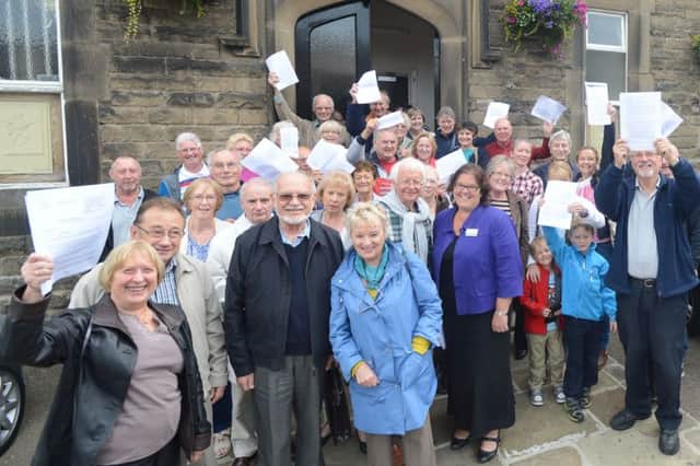 Protesters celebrate after the housing plans for the North Road area of Glossop were turned down