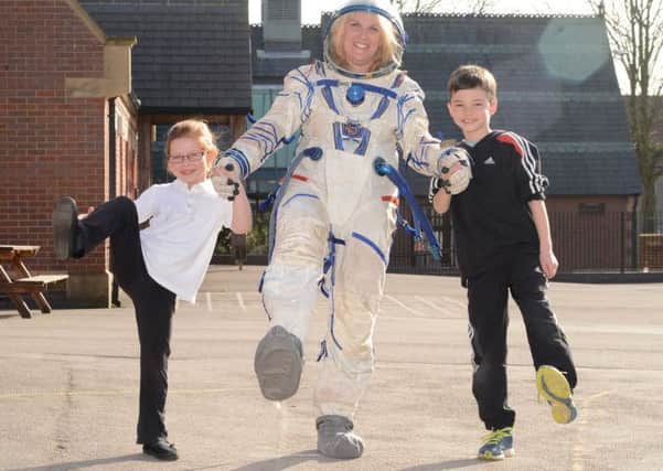 Barlborough Primary space suit, one small step for Melanie Edger and pupils Chloe Oliver and Louis Wright