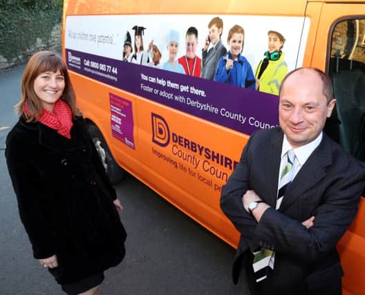 Mobilising a call to care: Cllr Kevin Gillott and fostering recruitment manager Kathryn Thompson with two of the newly branded vans
