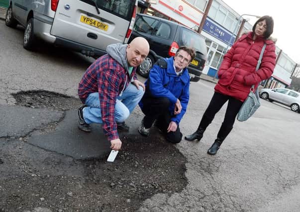 Pot hole problem at Summerskill Green shopping precinct in Inkersall. Paul Mann, Mick Bagshaw and Ruth Perry.