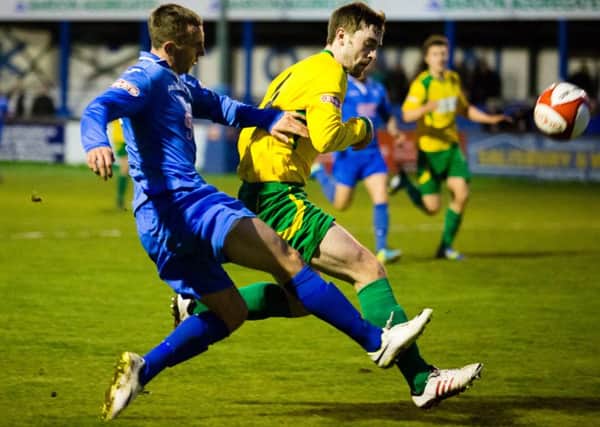 Shaun Tuton gets a shot away under pressure from a Blyth defender on Tuesday night. Photo by James Williamson.