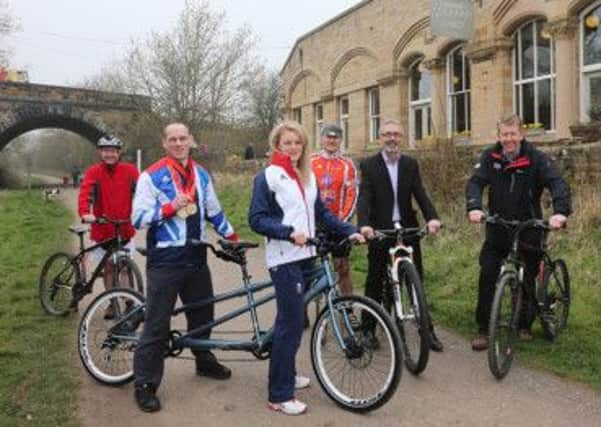 Caption: Triple gold medal winning Paralympic cyclist Anthony Kappes with Olympic mountain biker Annie Last  launch the Peak District & Derbyshire Summer of Cycling during English Tourism Week with Jim Dixon, of Peak District National Park Authority, Councillor John Owen, of Derbyshire County Council, James Berresford, of VisitEngland and David Jame, of Visit Peak District & Derbyshire.