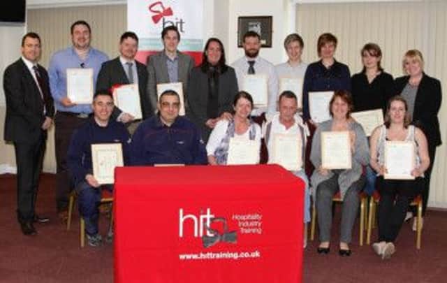 The HIT apprentices and some of their employers with Mike Worley (left) and Gail Naylor-Kelly (centre).