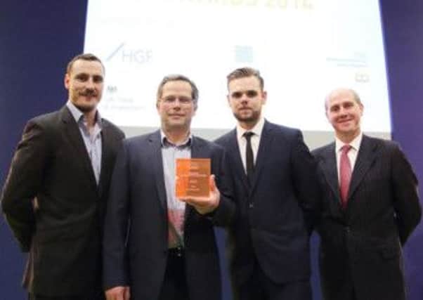Pictured are Jonathan Otter, Malcolm Wootton, Scott Franks, of Hathersage-based Francis Lamont Innovations Ltd, being presented a  Nabarro LLP Start-up Award at the Medilink UK Healthcare Business awards from Carl Dray, of Nabarro.