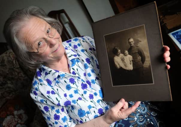 Rev Cynthia Hardiman with a photo of her grandfather, South Shields, Tyne and Wear, Rifleman Albert Penn.