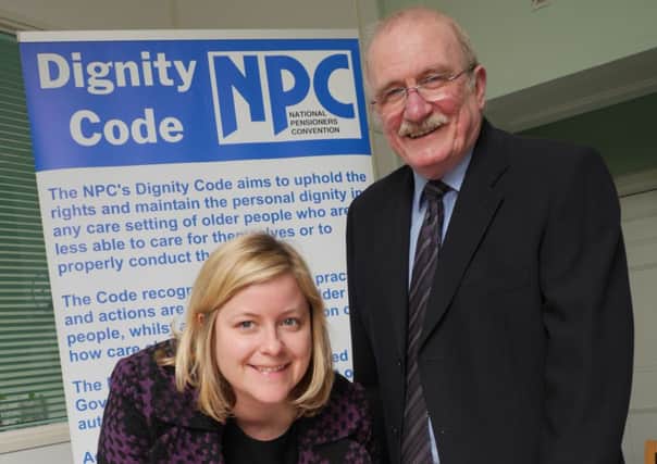 County Council Cabinet Member for Adult Social Care Cllr Clare Neill signs the Dignity Code with NPC representative Angus McLardy.