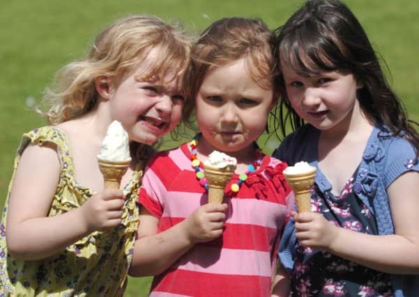 Fun in the sun at Hillsborough Park...........Emily Tomlinson,Ruby and Geiorgia May all aged 5 cool down with an ice cream