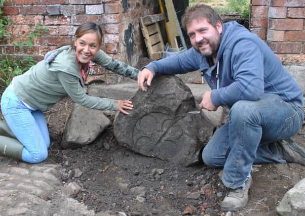 Rokia Brown and Andy Gaunt with the 13th Century quatrefoil