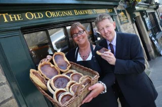 Julie Hurst, manager of the Old Original Bakewell Pudding Shop, and David James, chief executive of Visit Peak District and Derbyshire, celebrate Bakewell puddings bronze award.