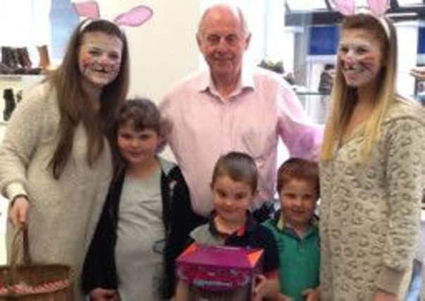 Buxton shoe shop Clarks' design an Easter egg competition winners Joe and Jacob Kidd pictured with their sister Rachel, Keith Martin and Easter bunnies Niamh and Alice. Photo contributed.