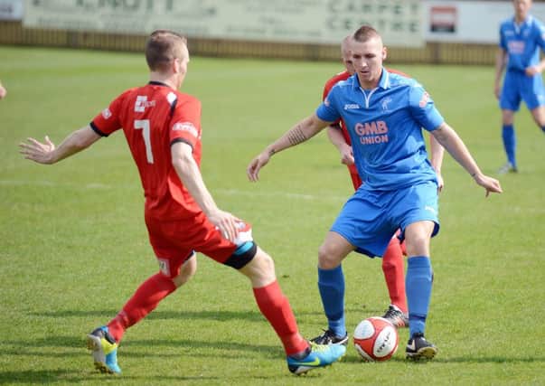 Matlock scorer Oscar Radford gets in on the action against Buxton on Saturday. Photo by Brian Eyre - NMAM 21-04-14 BE 04.