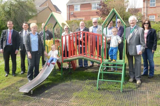 Parish councillors and guests were joined by little Arthur and Amelie Troke at the opening of the new play area.
