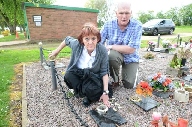 Pauline Briggs with her husband Nick at Lee's grave.