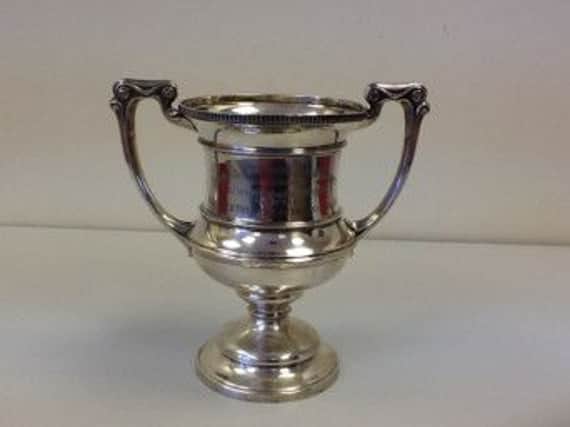 The historic trophy, which is to be returned to Buxton Tennis Club after being found on a waste tip.