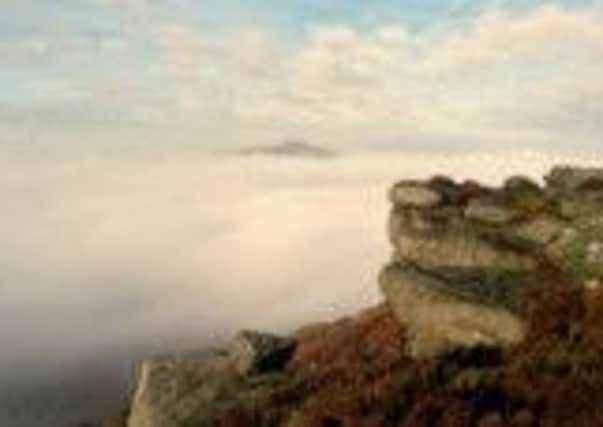 Bamford Edge in the early morning mist, by Ken Taylor.