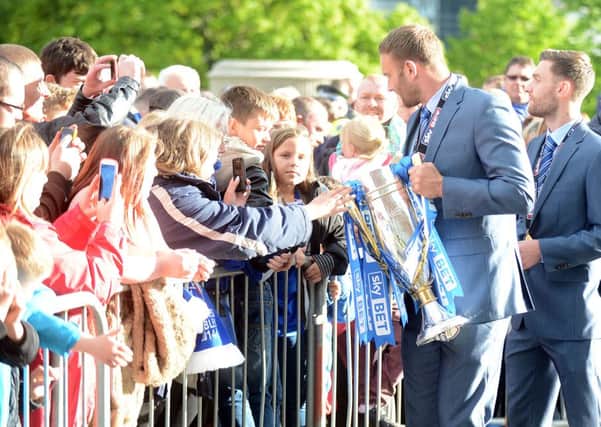 Chesterfield fc victory parade through the town. Players sign autographs and meet the crowd.