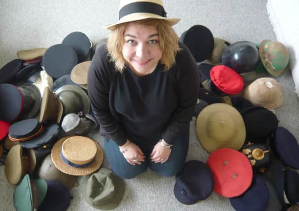 Producer Katie Preece with some of the hats she has collected for Dronfield Light Opera Group's production of Oh What A Lovely War