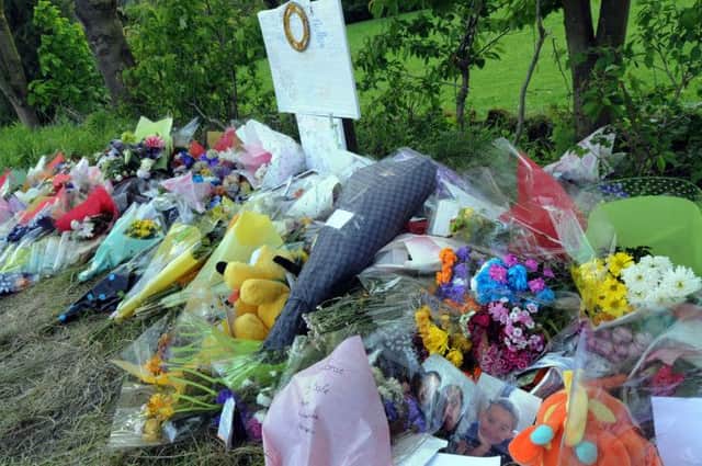 Floral tributes have been left at the scene of the crash.