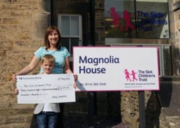 Picture is Harry Leverton giving Ann Wyatt, the House Manager at Sheffields Magnolia House and Treetops House from the Sick Childrens Trust a cheque donation. The money was raised from a black-tie dinner.