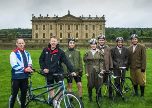 Paralympian, Anthony Kappes MBE, and Visit Peak District & Derbyshire Chief Executive, David James, welcome charity cyclists from The Camping and Caravanning Club to Chatsworth on day 4 of their 420-mile cycle-camp challenge. (Pictured l-r  Anthony Kappes, David James, Stuart Airey, Kimberley Keay, Richard Satterthwaite, Dylan Griffiths and Spencer Pettit.