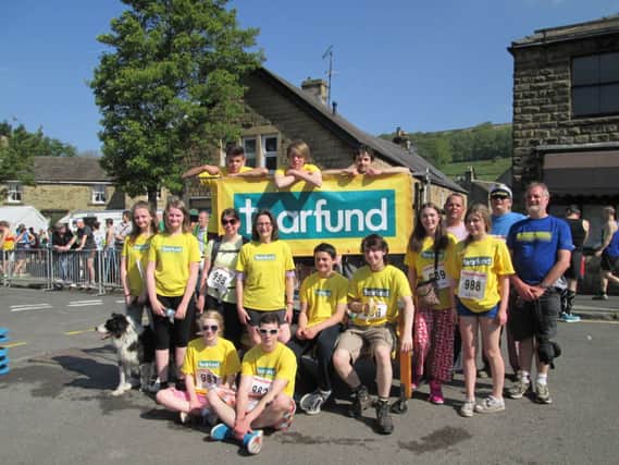 Eyam Church youth group completed the Eyam half marathon pulling a bed in aid of charity Tearfund. Photo contributed.