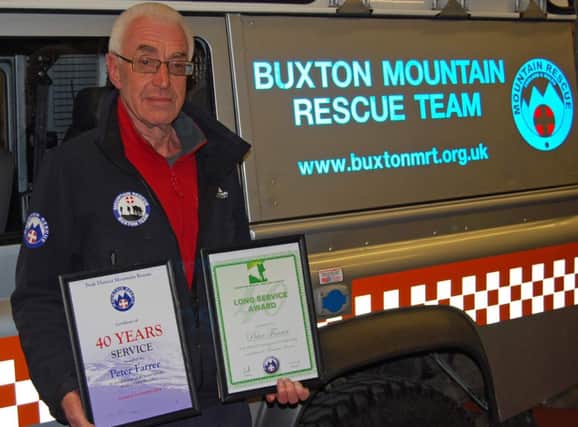 Peter Farrer, from Chapel-en-le-Frith, has been presented with an award to mark 40 years of service with Buxton Mountain Rescue Team.