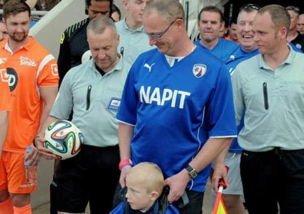 Charity match at Chesterfield Proact Stadium. Six-year-old Josh Higginbottom who led the teams out with his Dad 
Alan.