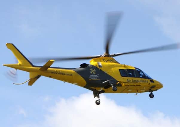 The Derbyshire, Leicestershire and Rutland Air Ambulance lands at an incident at Mam Tor