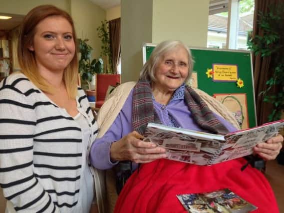 Student Millie Stacey-Pearson with resident Jean Rodwell.