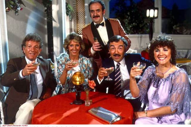 Keith Barron, Joanna Van Gyseghem, Neil Stacy, Gwen Taylor and. Carlos Douglas [Waiter] in the TV programme Duty Free.