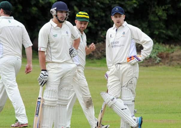 Batsmen Andy Roberts and Ed Lowe consider their options against Rolleston. Photo by Anne Shelley (nmam 14-06-14 as 4)
