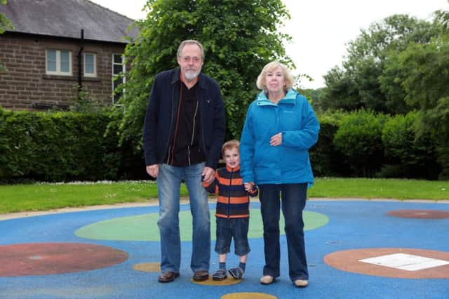 Picture shows Anne Barrett, 76 and partner Stuart Delk with grandson Isaac, 4 at Bakewell Recreation ground where a childrens water park has been closed due to noise complaints from neighbours

See copy RPYPARK

rossparry.co.uk / Steven Schofield