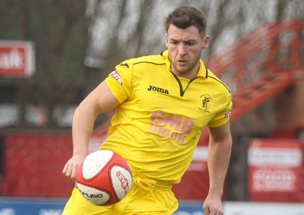 Micky Harcourt has signed a new deal with Matlock Town.