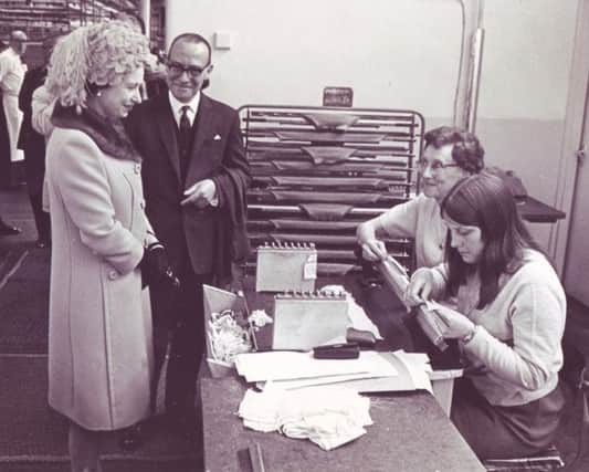 The Queen at John Smedley Limited, Lea Mill
The Queen with Managing Director Mr W.T. Holder, talks with Minnie Parker (centre) and Susan Moore, during her tour
10th May 1968