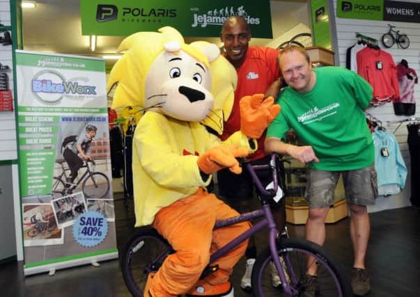 Andrew Morris, centre, the Synergy Sports Community manager and Michael Burr, assistant manager at JE James, invite readers to name the mascot, with a Giant Method BMX bike up for grabs for the winning suggestion.