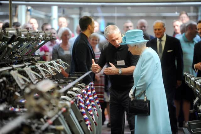 DEIH20140710A-018_C.JPG Picture: Ian Hodgkinson
The Queen and The Duke of Edinburgh have visited John Smedley at Lea Bridge in Matlock.
Pictured The Queen being shown round the factory