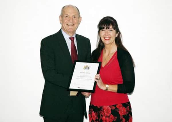Paula Shaw receives her award from Professor John Coyne.