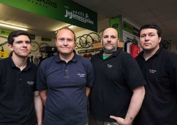 JE James Cycles promo feature. Phil Hubbard, Michael Burr Assistant Manager, Gavin Bryan and Rob Taylor.