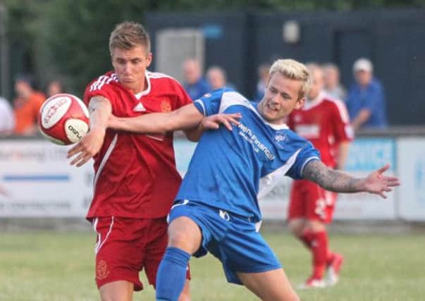 Matlock's Corey Gregory tussles for the ball  -Pic by:Richard Parkes