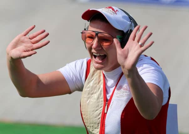 England's Caroline Povey celebrates her bronze medal following the Women's Trap finals at the Barry Buddon Shooting Centre in Carnoustie, during the Glasgow 2014 Commonwealth Games. Photo by Gareth Fuller/PA Wire.