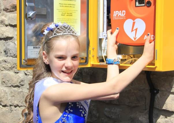 The Winster defibrillator was formally unveiled by Carnival Queen, Natasha Slater, on Wakes Saturday