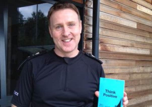 Pictured is Sgt Paul Smith, of Bolsover police, promoting the Think Positive ticket campaign to reward youngsters for good behaviour.