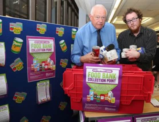 Councillor Dave Allen (left) and food bank volunteer Ben Martin launch Derbyshire County Council's food collection points