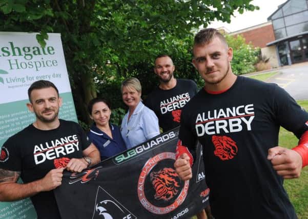 Mixed martial arts (MMA) fighter Jay Chadburn raises money for Ashgate Hospice with the sale of tickets for his next fight in honour of a grandmother and grandfather who were both cared for at the hospice. Pictured l-r is Lee Bown, Annette Gibson, Angela Bassett, Rob Watson and Jay Chadburn.