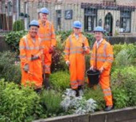 Friends of Glossop Station gardening at 6am on Sunday. Photo contributed.
