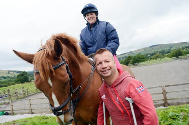 paralympian Lee Pearson with Clare dangerfield at Chapel and district riders club.