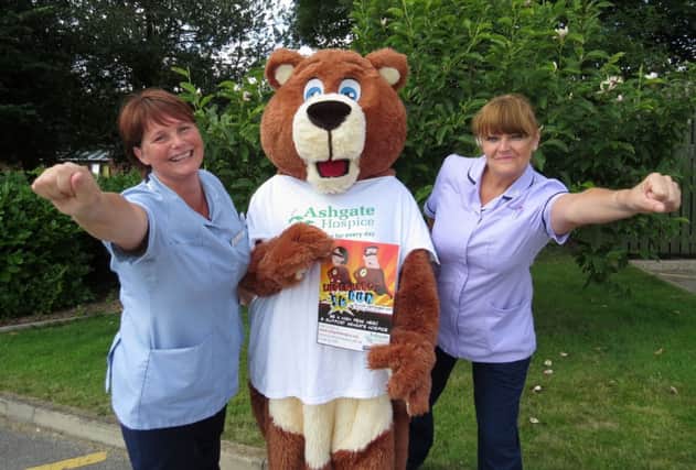 Staff at Ashgate Hospice prepare for Superhero 5K with the hospices mascot Ashley Bear.